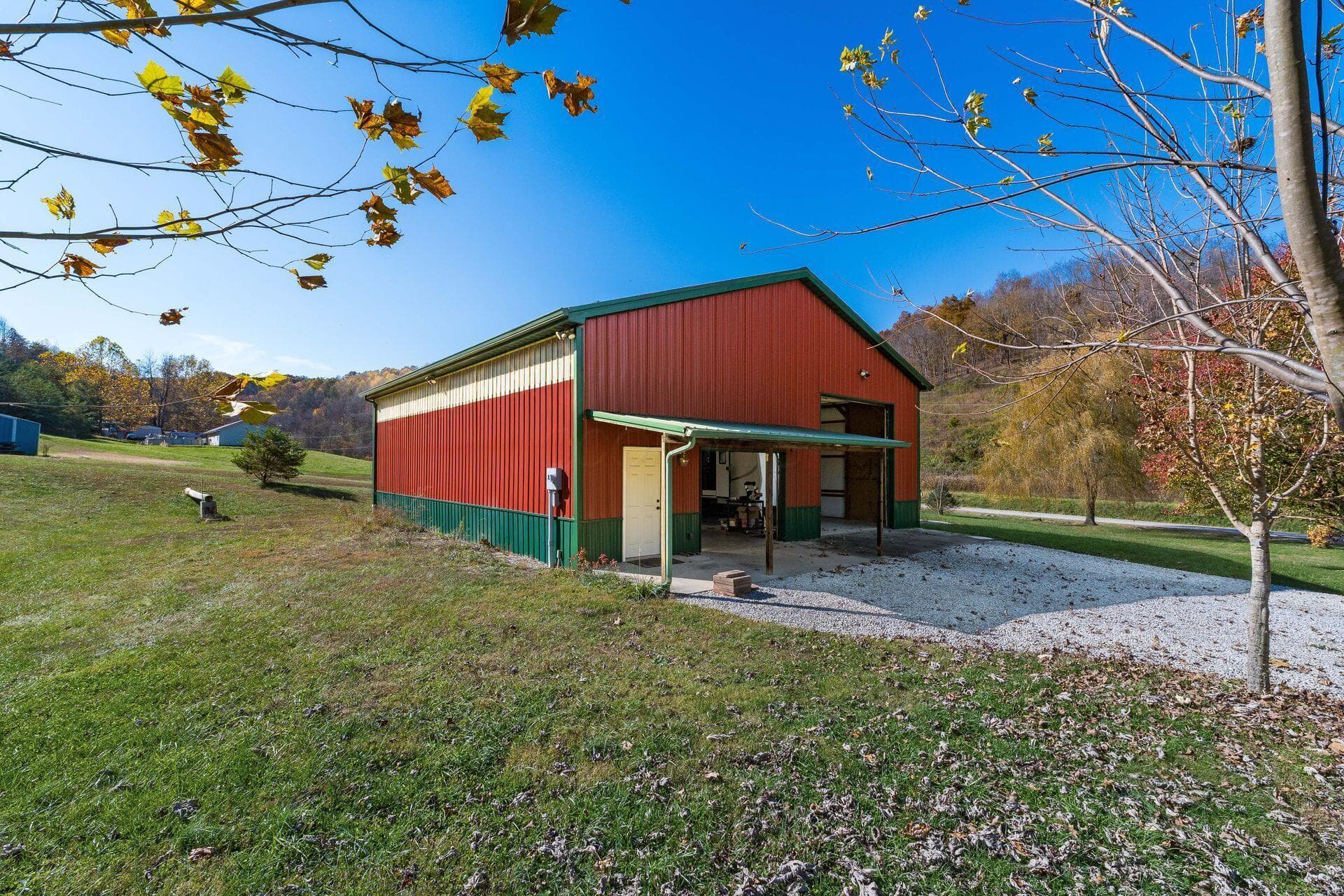 Bring your Big toys..Amish Built with high ceiling, loft area, great lighting, Tons of Electric outlets, Multiple breaker boxes,2 overhead doors 40x45 concrete floor plus camper hook ups.