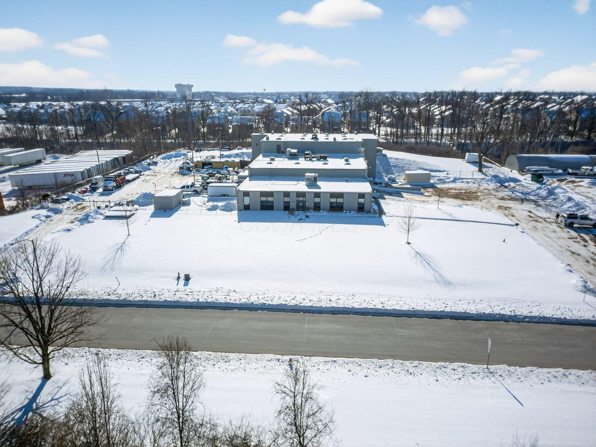 Front of building and surrounding parking/storage