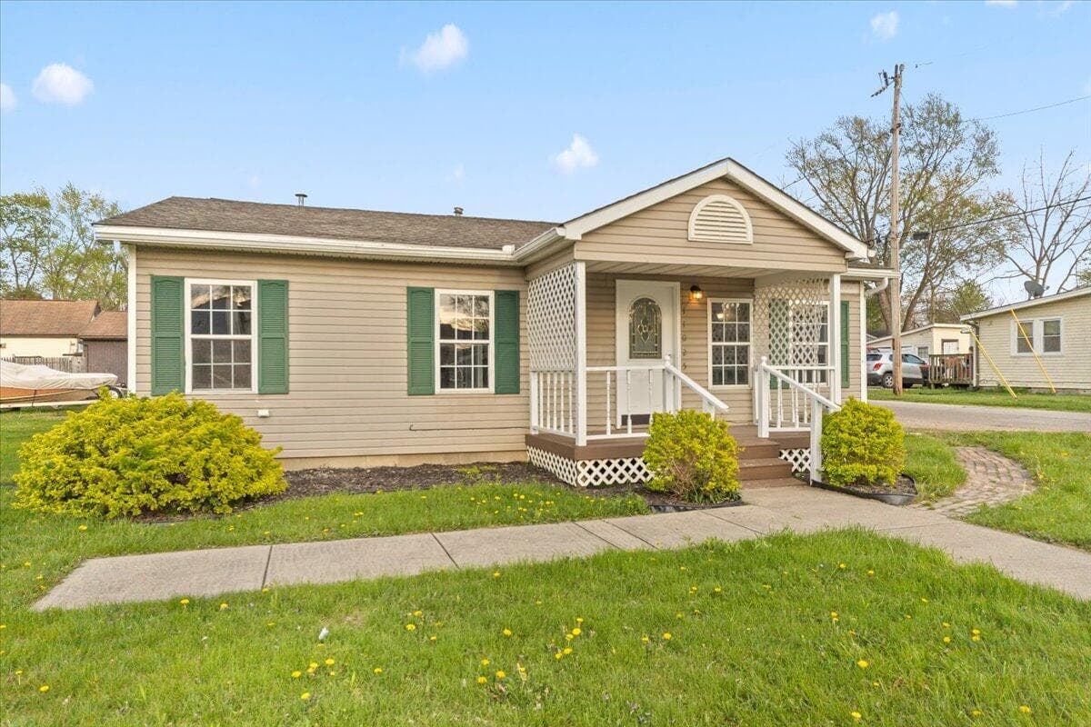 Great curb appeal with covered porch. Can also be business, as zoned.