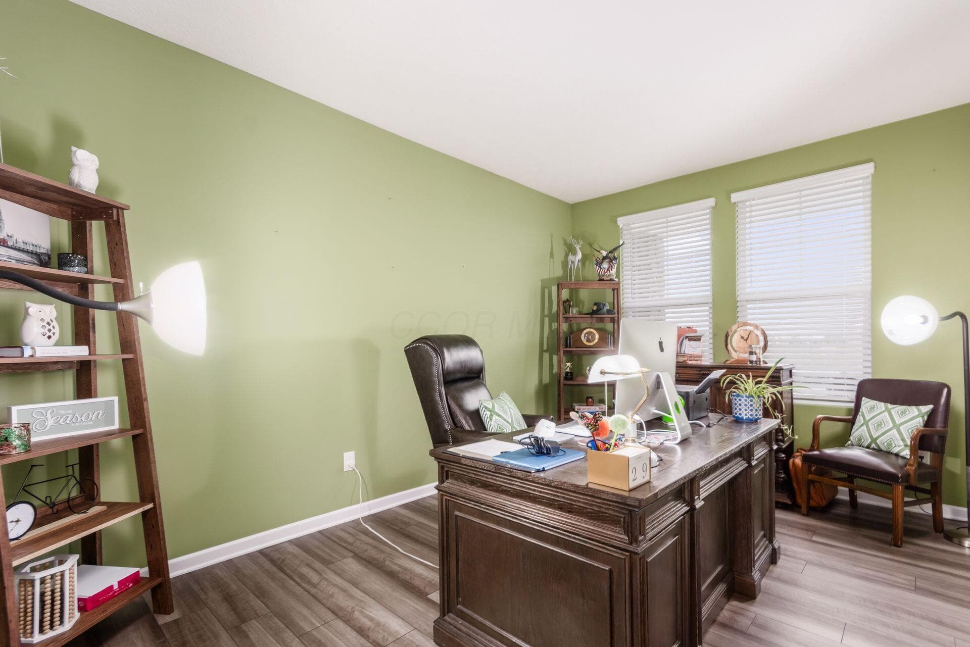 The study has 2 large windows and LVP floors