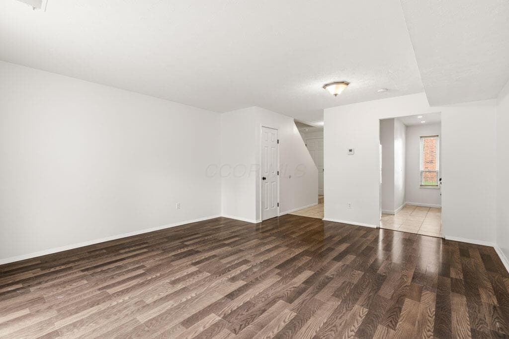 Great room leading to kitchen and hallway.