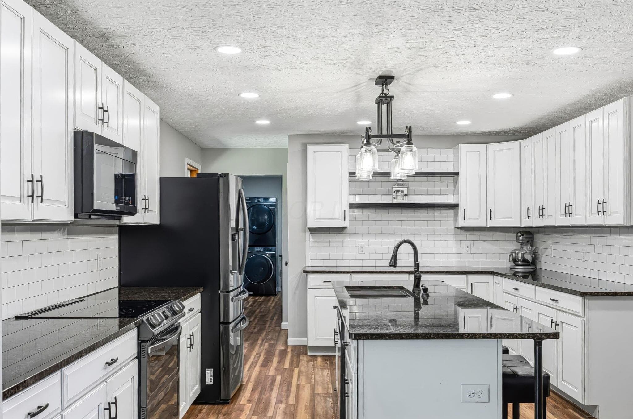 The kitchen is spotless, with beautiful stainless steel appliances