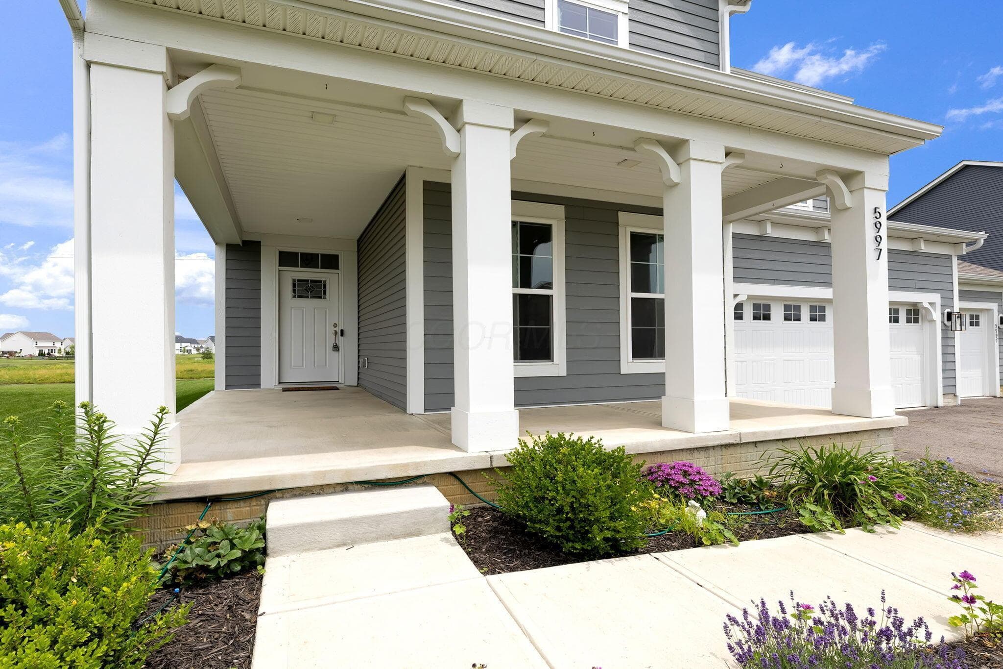 Large wrap around front porch perfect for greeting friends and relaxing!