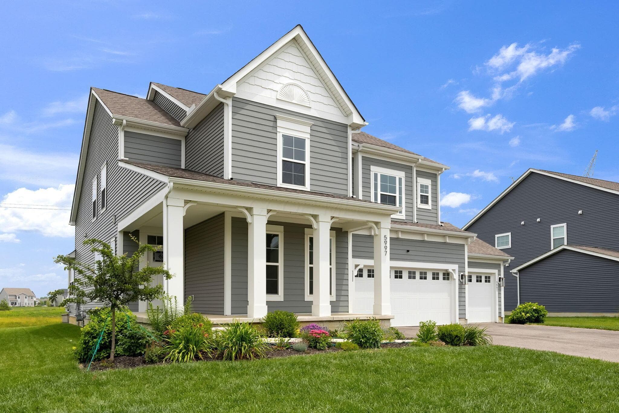 3 car garage and a lot of architectural detail abound in this home.