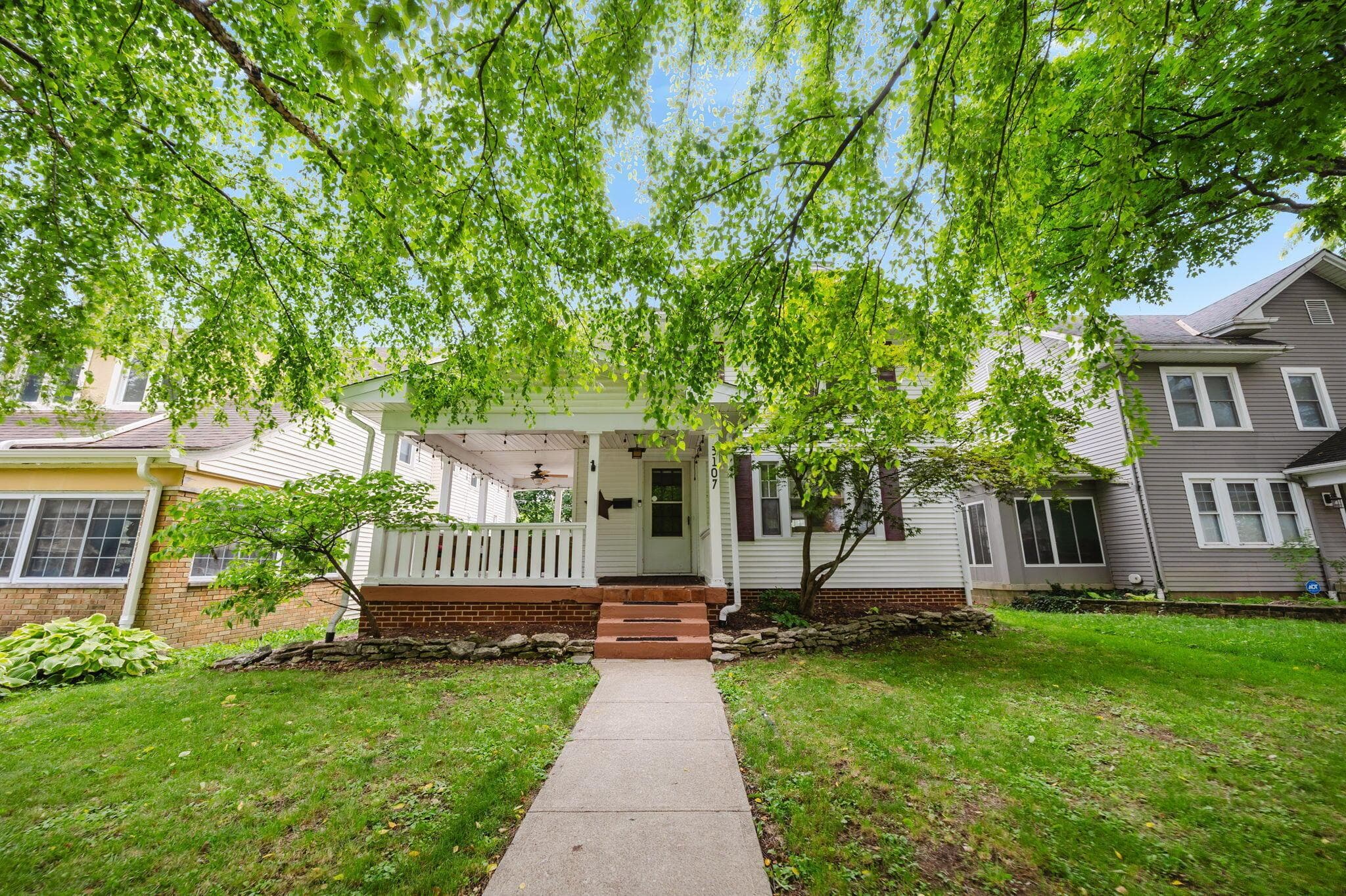 3 bedrooms, 1.5 bathrooms, 1 car garage, and mature landscaping.