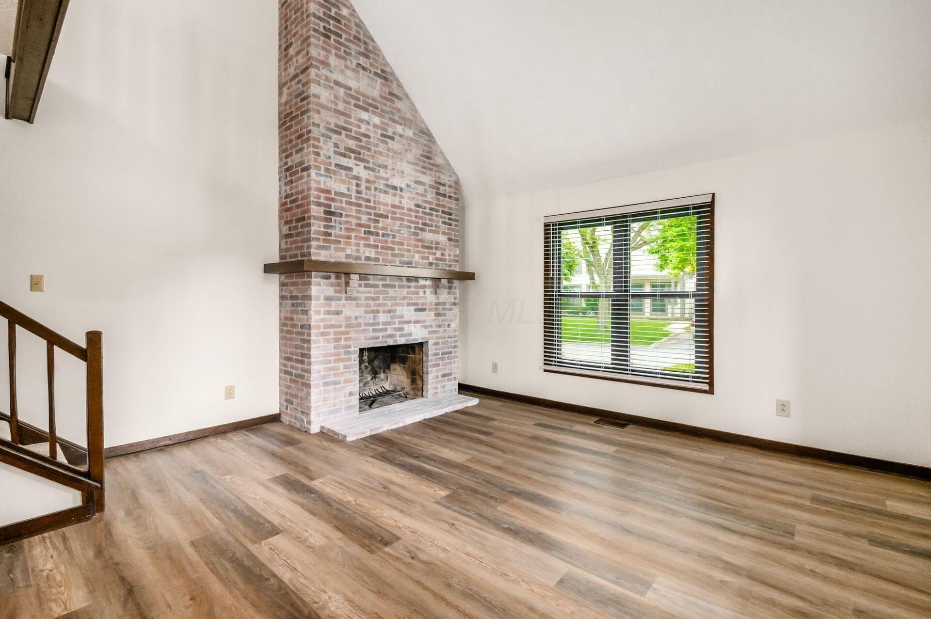 Whitewashed woodburning fireplace