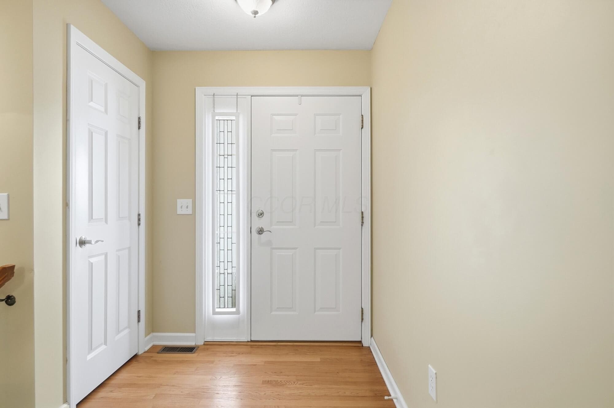 Foyer with large coat closet.