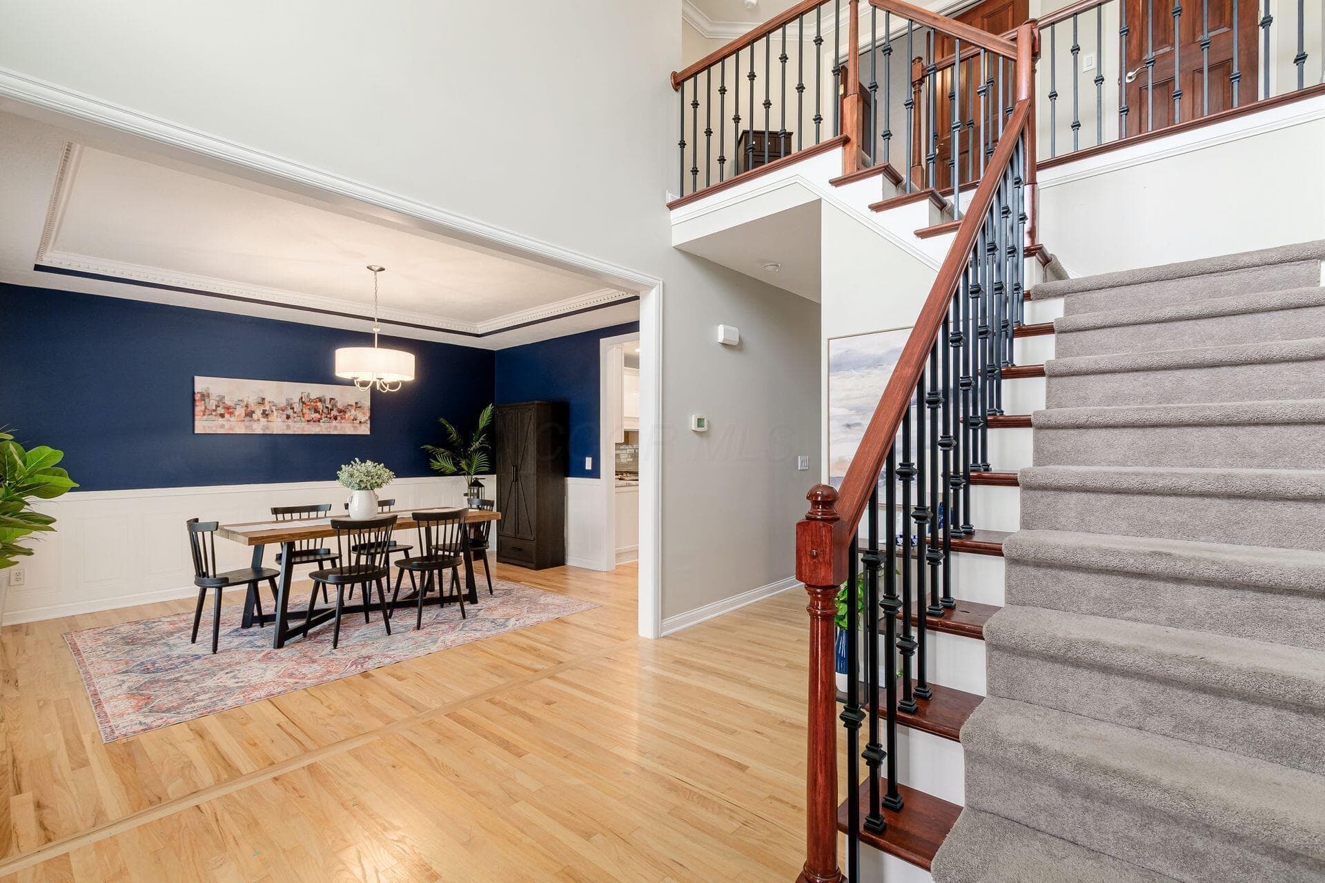 Solid hardwood floors and updated wrought iron spindles