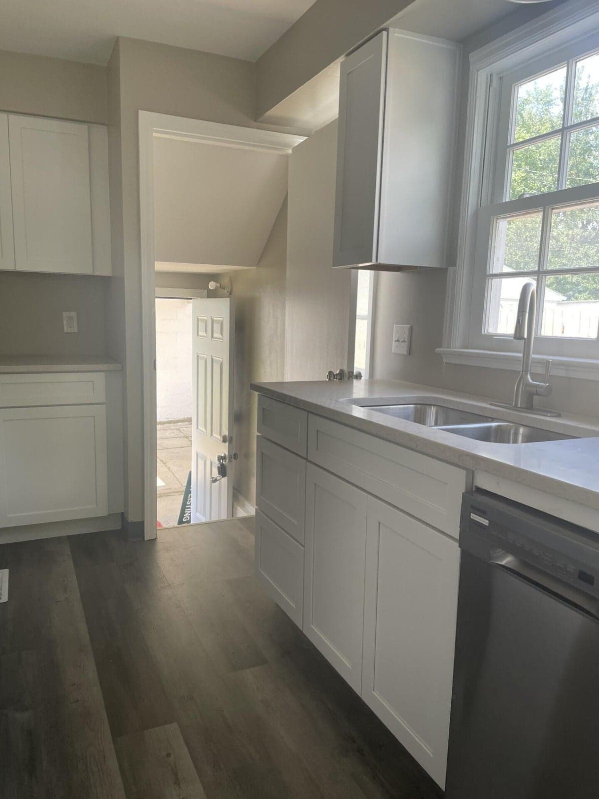 the door in the picture leads to the back door and patio area.