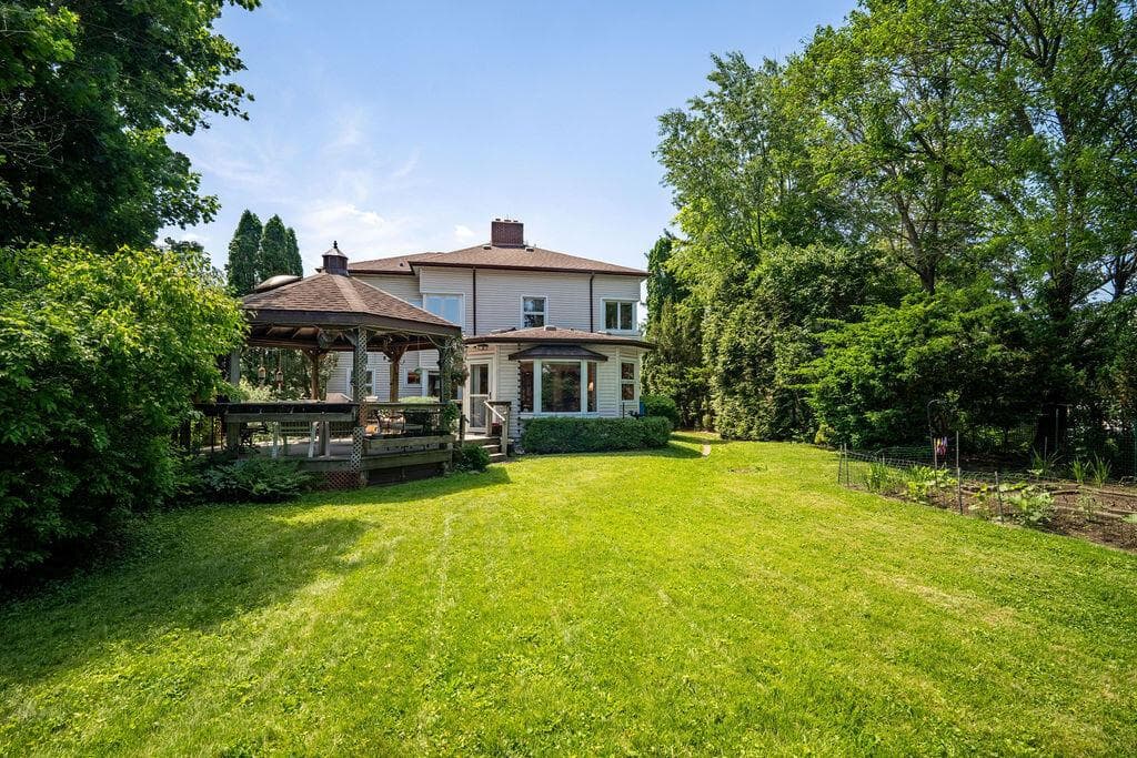This backyard is an entertainers dream with gazebo, expansive backyard and plenty of space for gardening!