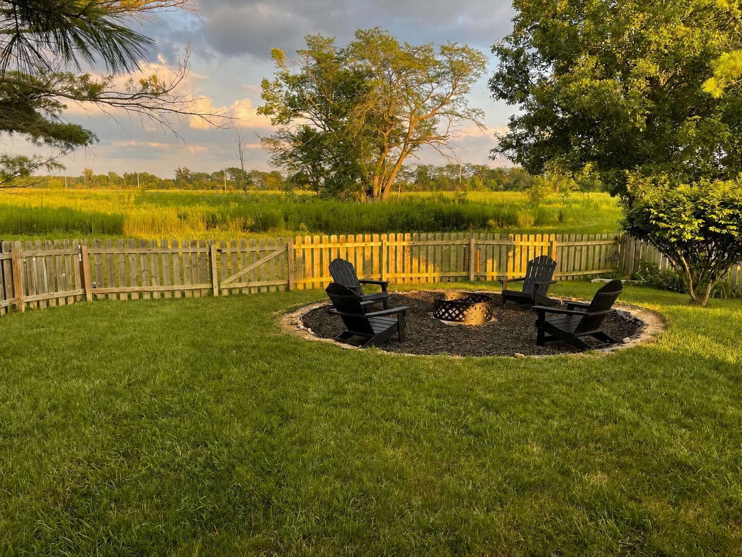 Chairs added to firepit area by AI