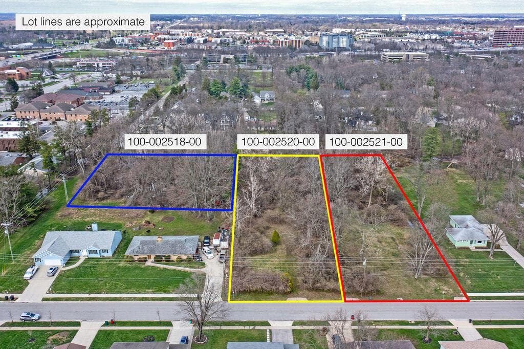 Three distinct parcels of undeveloped land are presented, featuring mature trees and varying topography