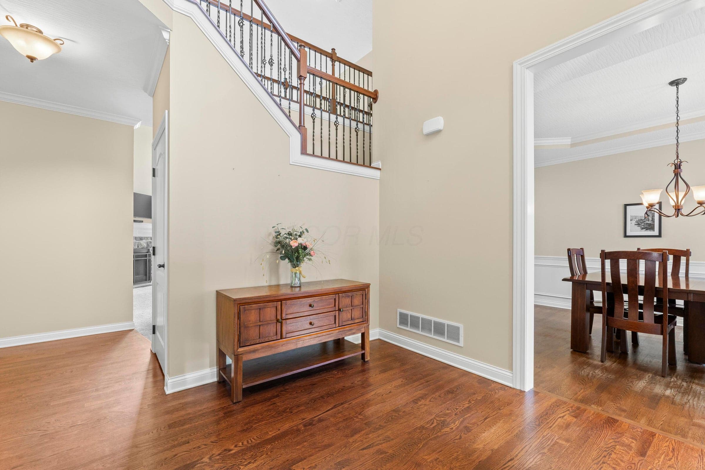 • Hardwood flooring • Wheat painted walls • Sidelights by front door • Two-story ceiling • Chandelier • Coat closet