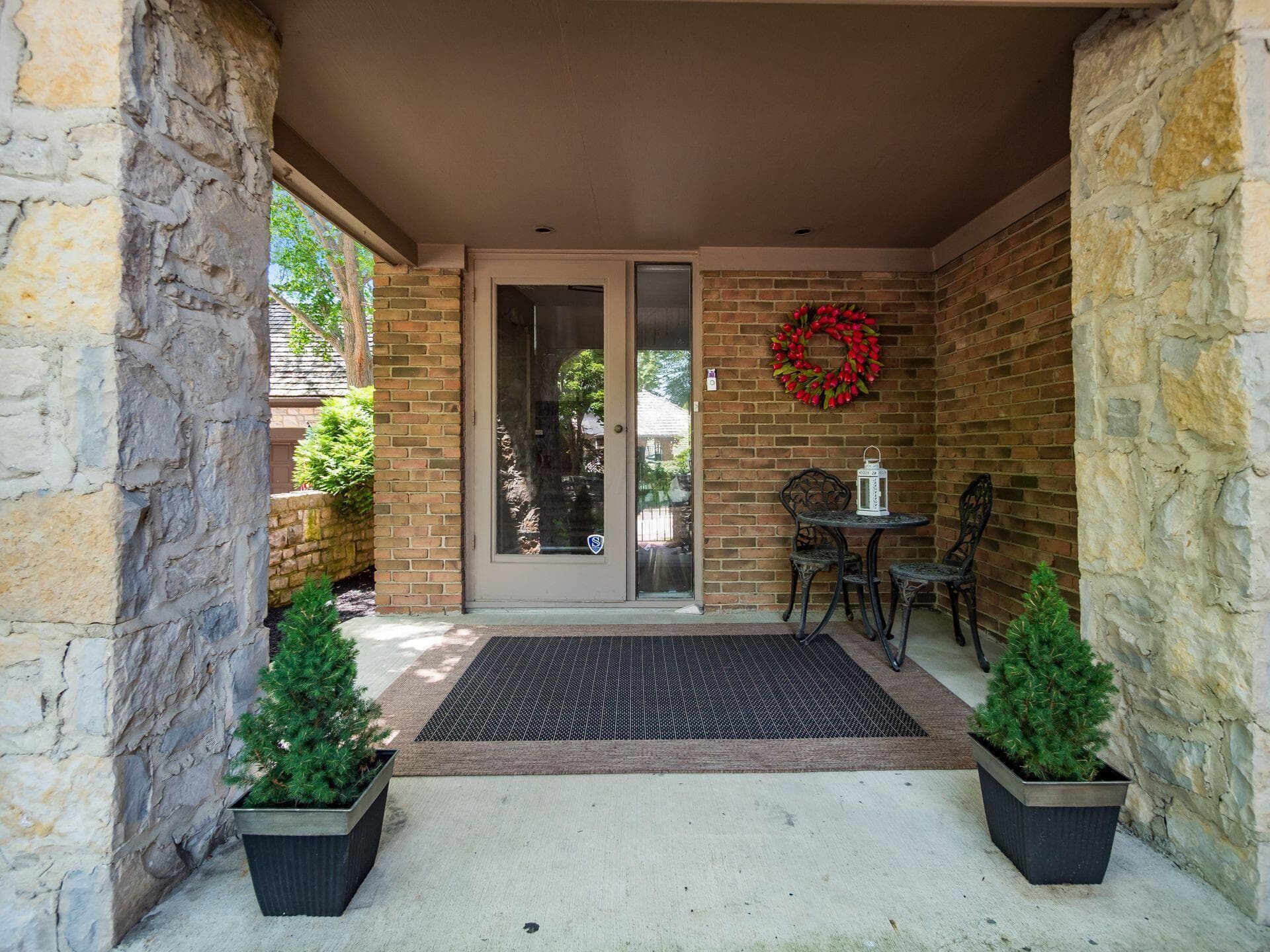 covered from porch with stone front