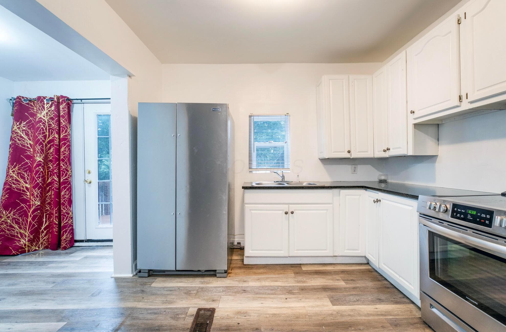 2640 W. Broad St. Kitchen with backdoor to deck