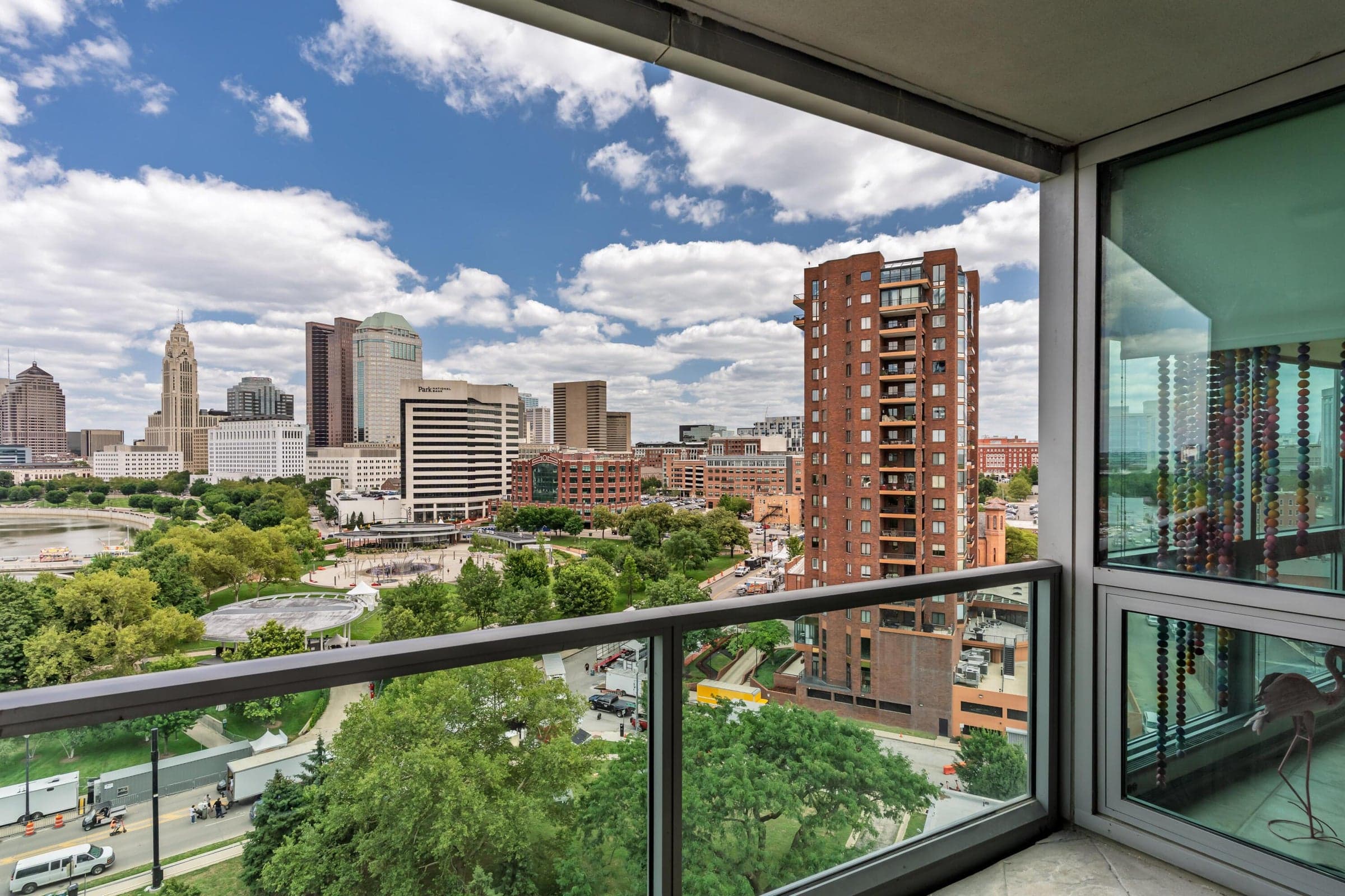 Elevated city and riverfront views from the balcony.
