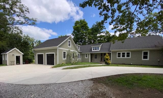 West side of house and parking lot.