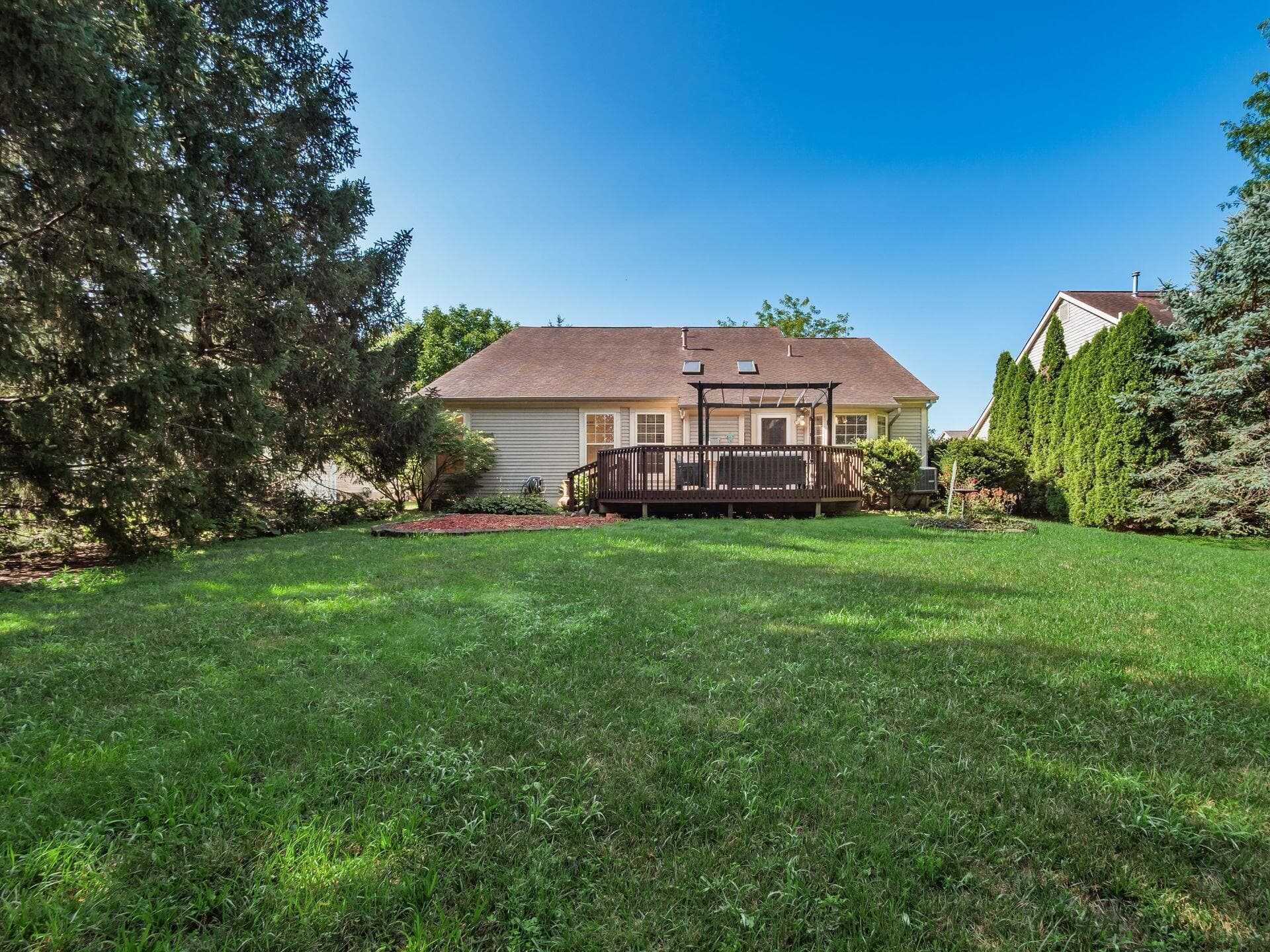 The deck overlooks the private wooded lot! Great for outdoor entertaining!