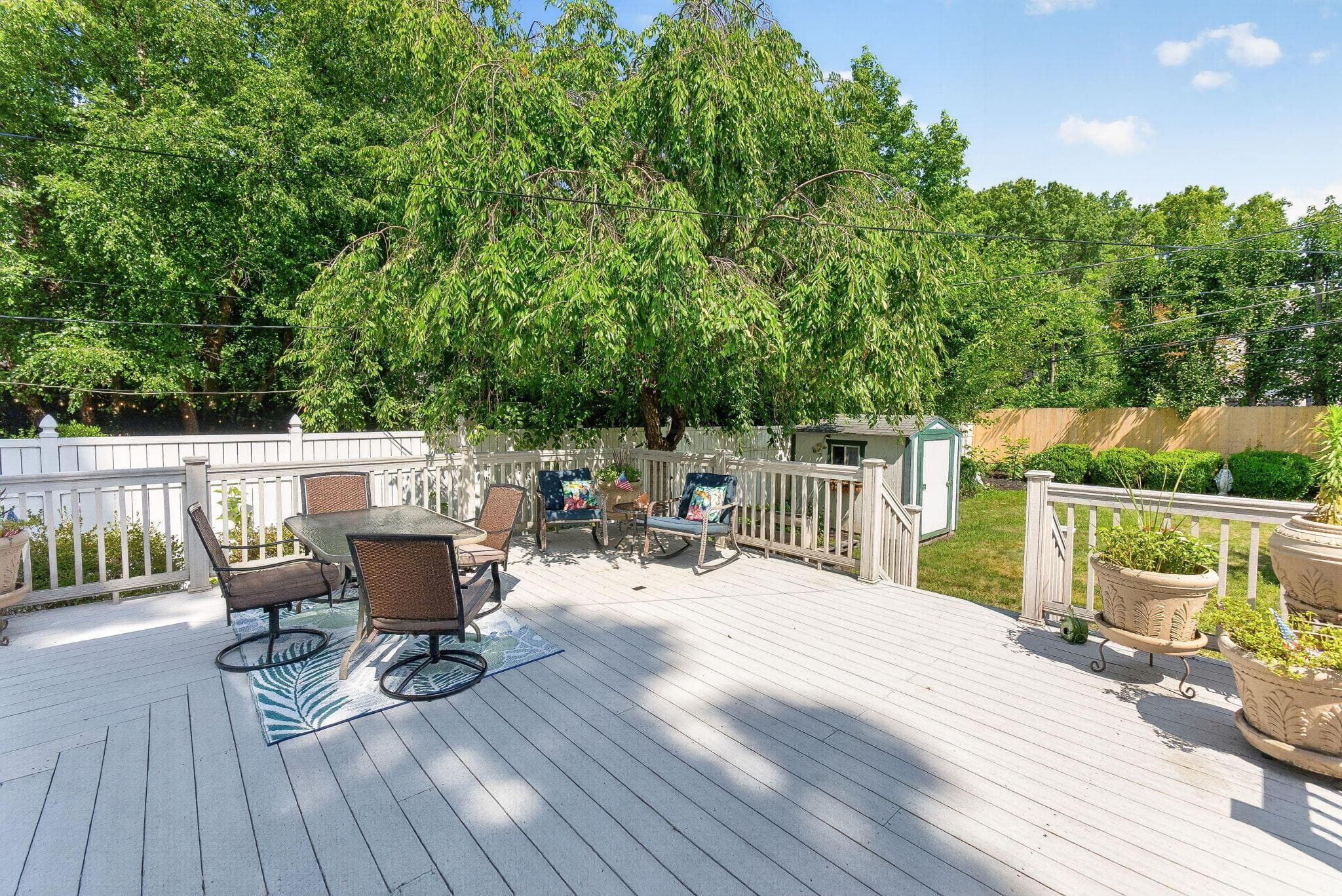 Expansive Completely Fenced in Backyard with large wrapped composite decking with Shed!
