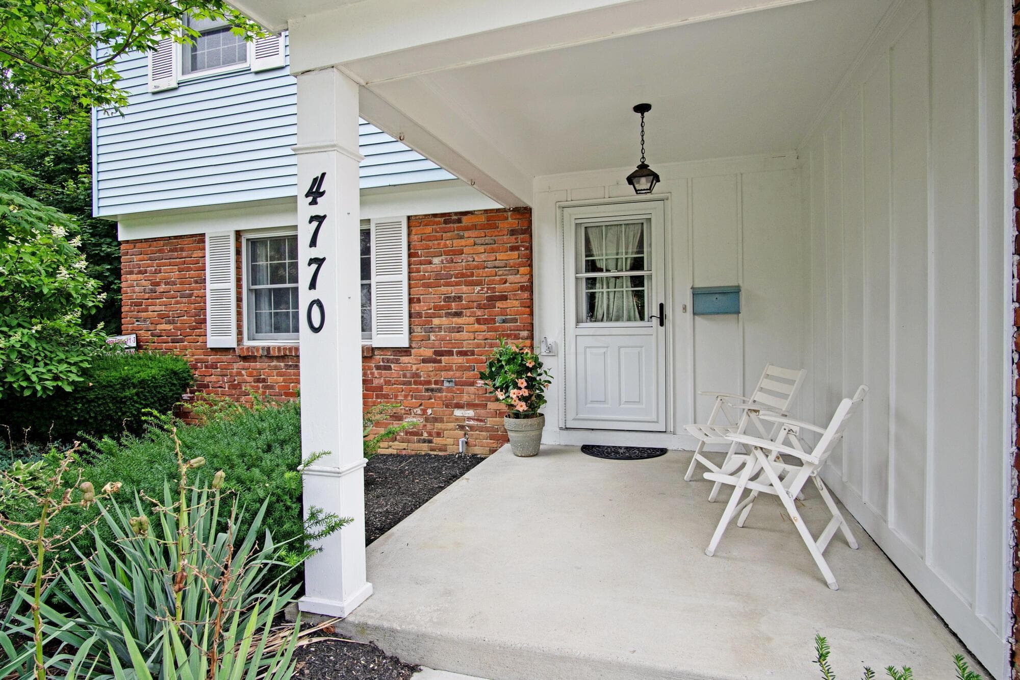 Relax enjoy your day & neighbors on this covered front porch.
