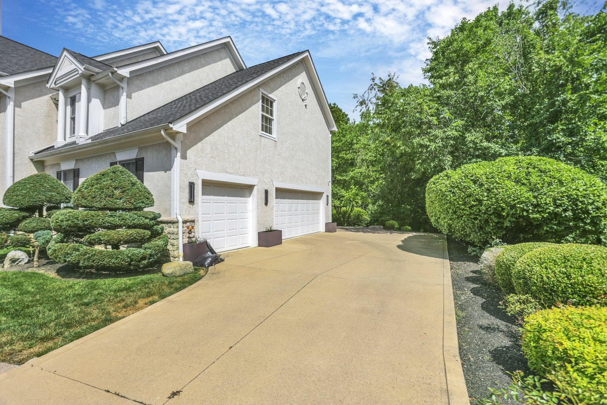 Stucco exterior with a two-car garage
