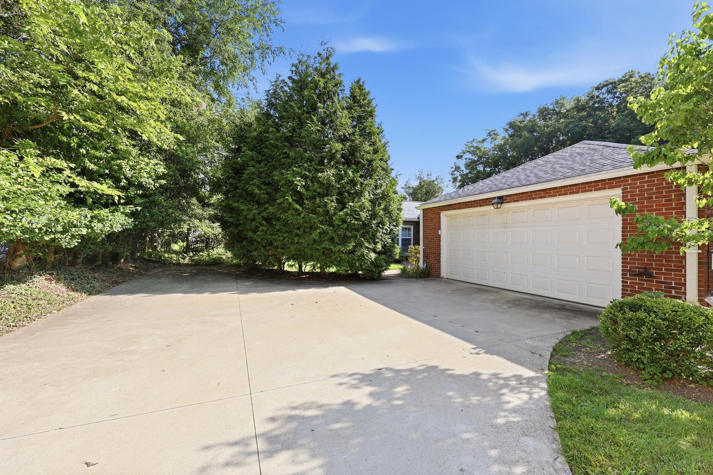 Two-car attached garage with white panel door