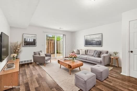 13 King Arthur Ct. GREAT ROOM with sliding door to private patio.