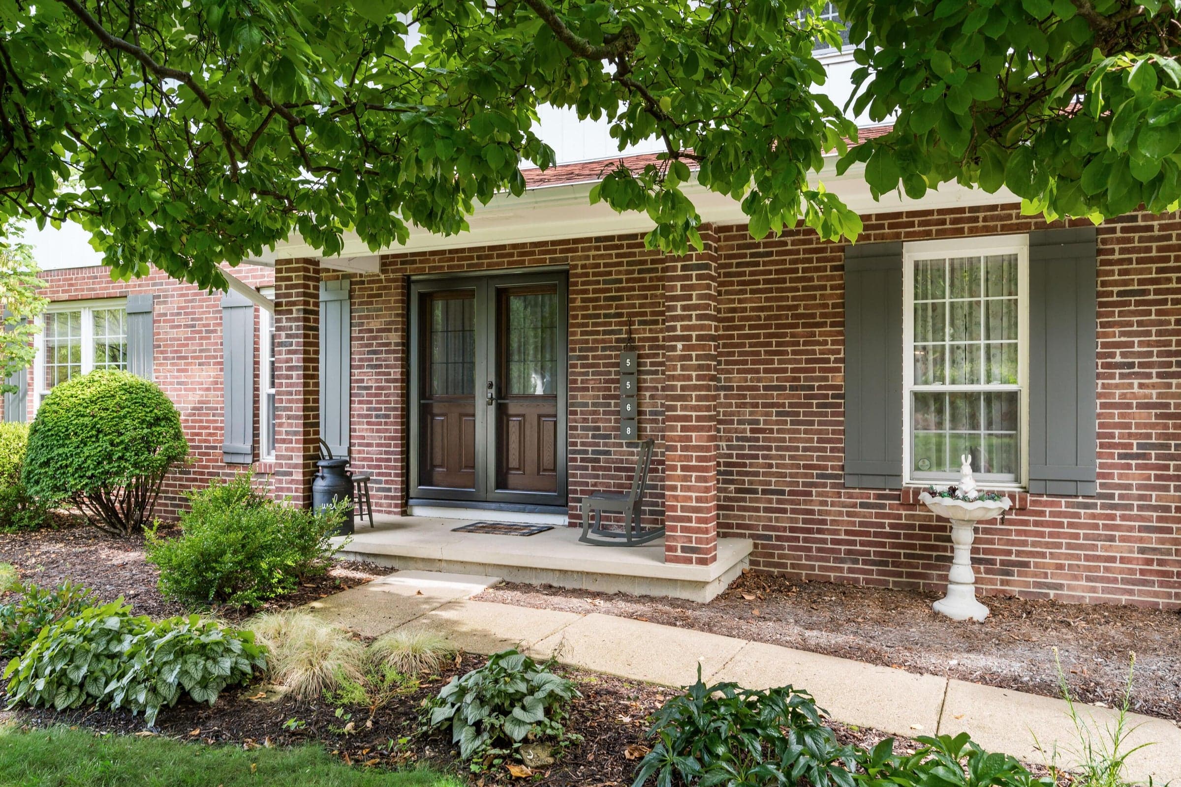 Covered front porch, brick and siding exterior