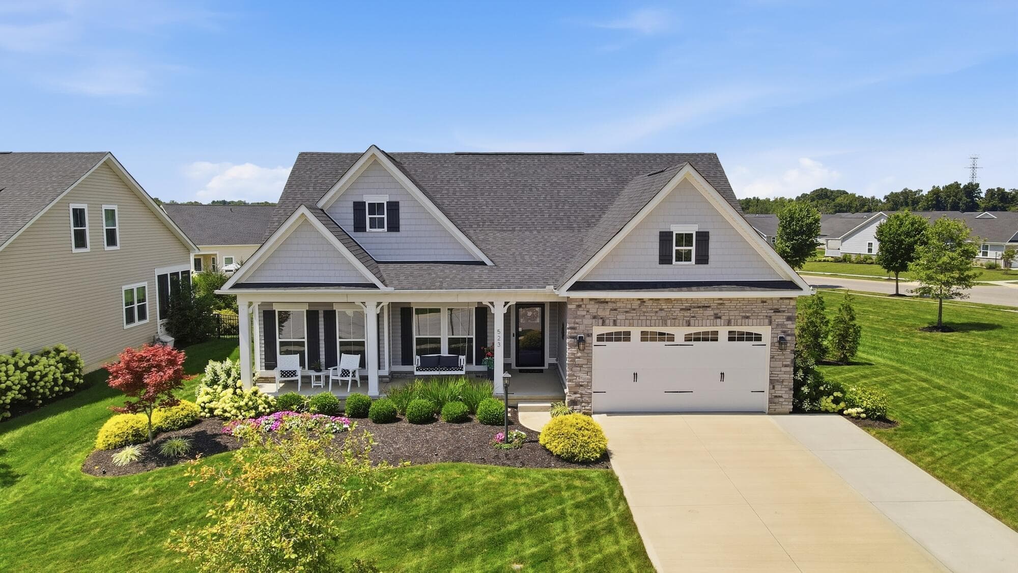 BEAUTIFUL FRONT WITH LUSH LANDSCAPING