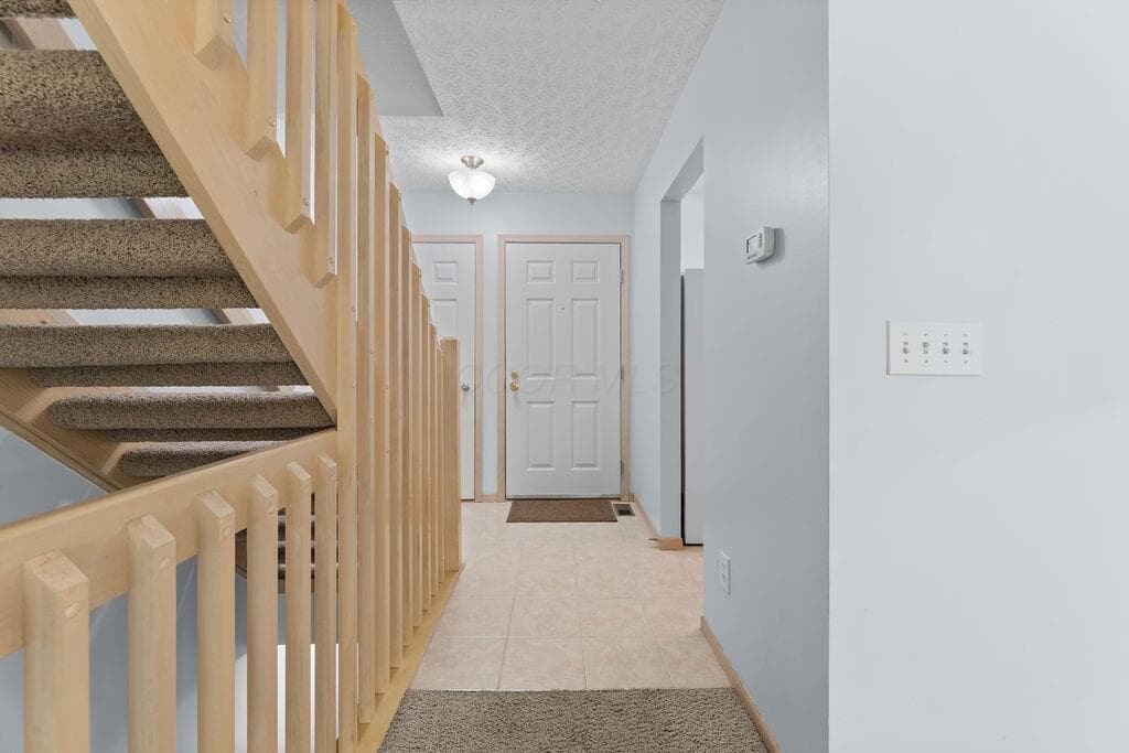 • Ceramic tile flooring • Grey painted walls • Ceiling light