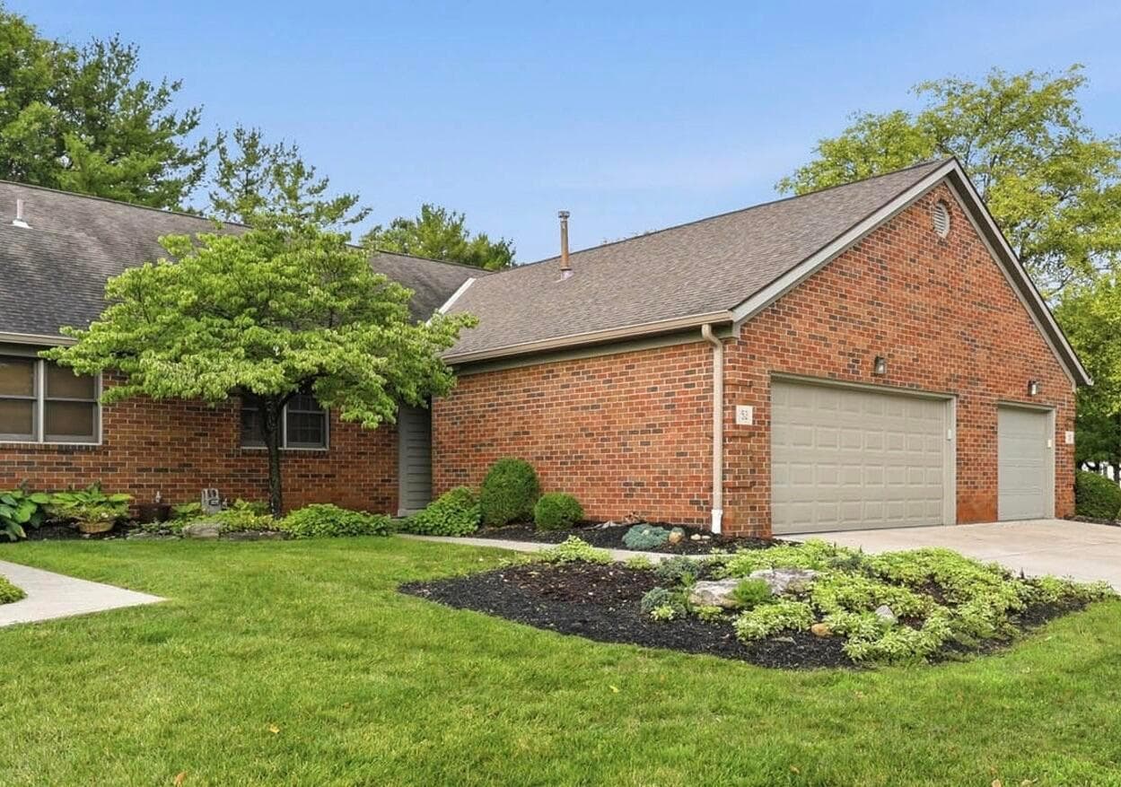 Brick exterior, 2 car garage, concrete driveway, landscaped front yard, and a single story design