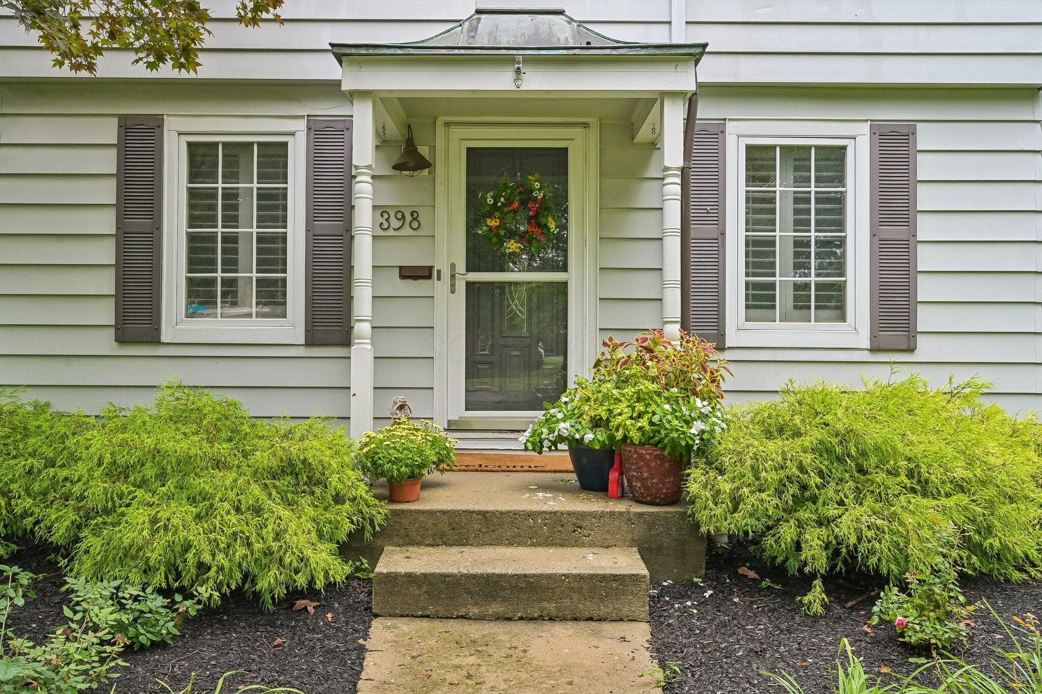 Sidewalk leads to covered entry
