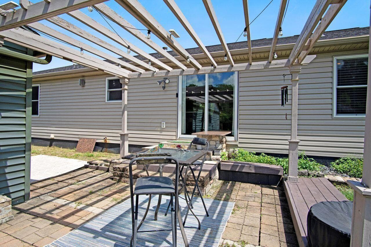 Extensive patio with several serving areas & grill