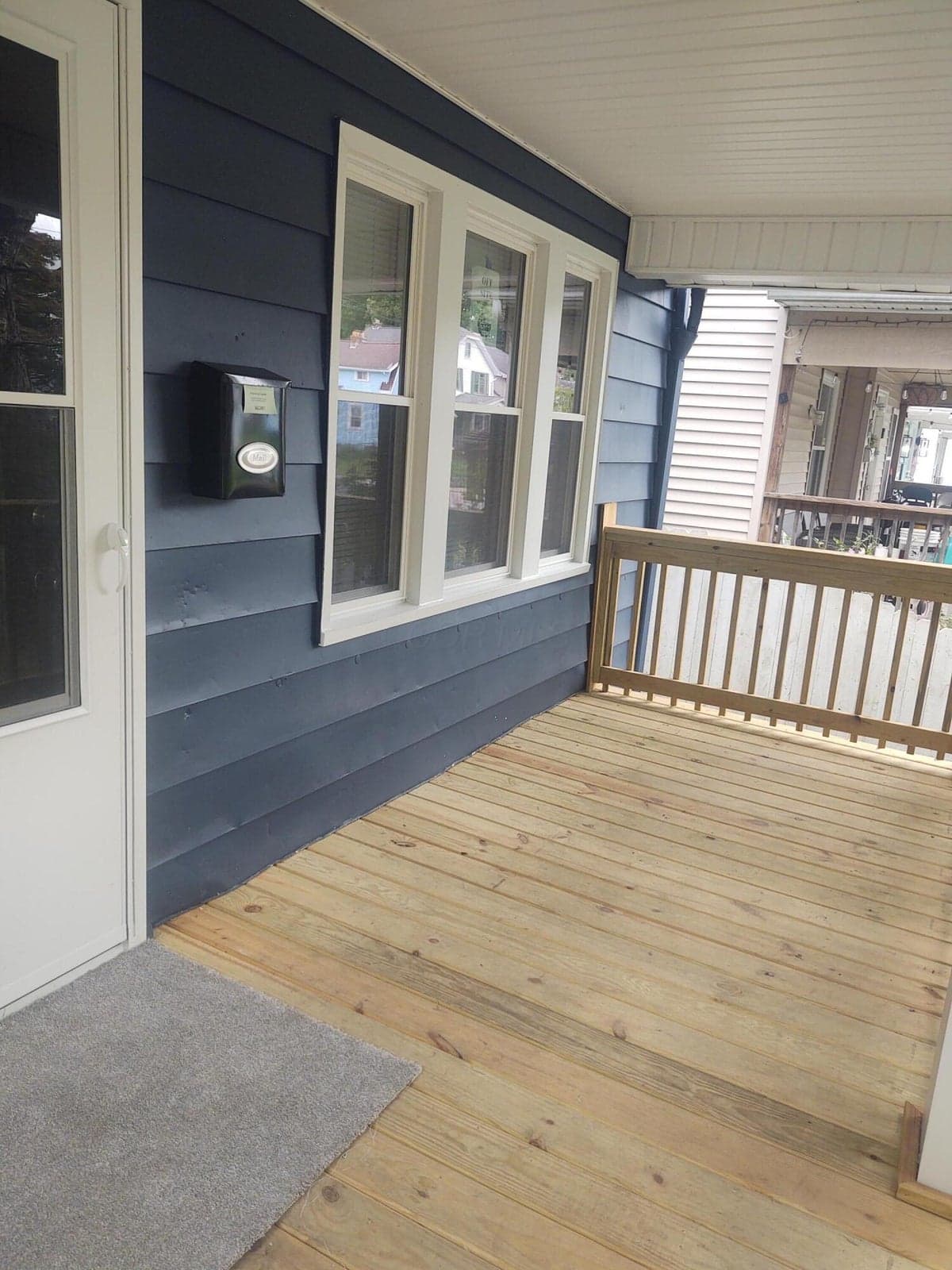 New Front Porch, solid wood with railings.