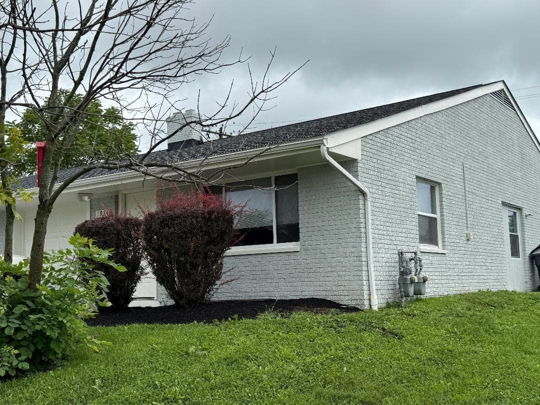 White painted brick exterior with white trim