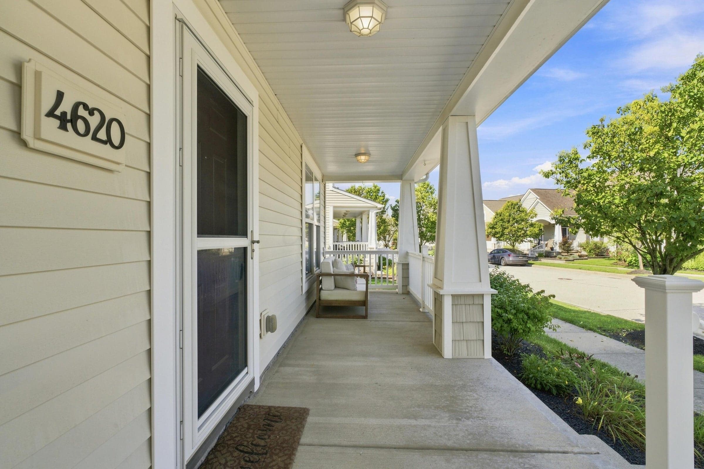 This home's curb appeal is beautiful! Lush landscaping and a desirable Craftsman-style home in a community that's tree-lined and quaint!