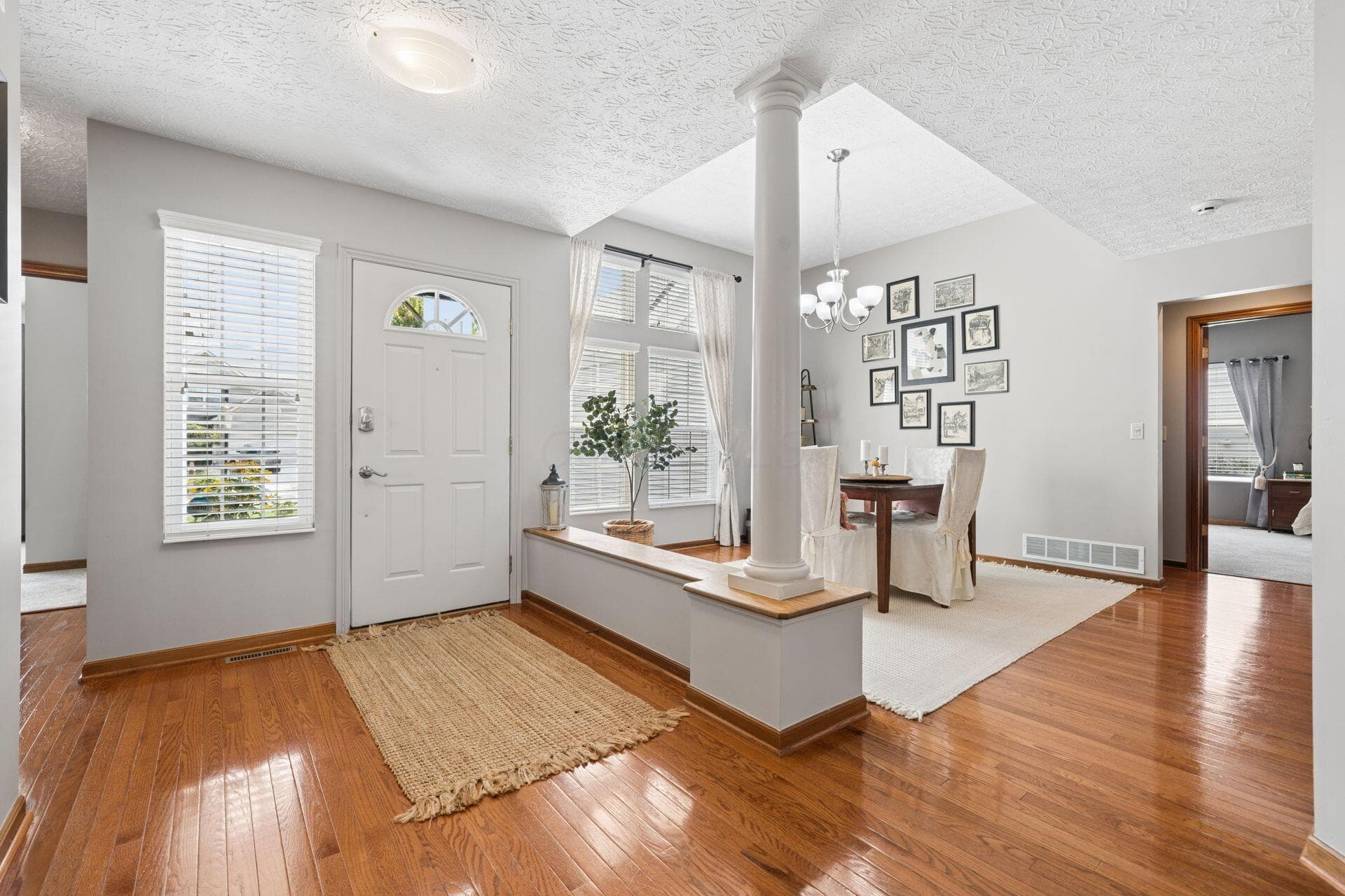 Light-filled entry and dining room or sitting area.