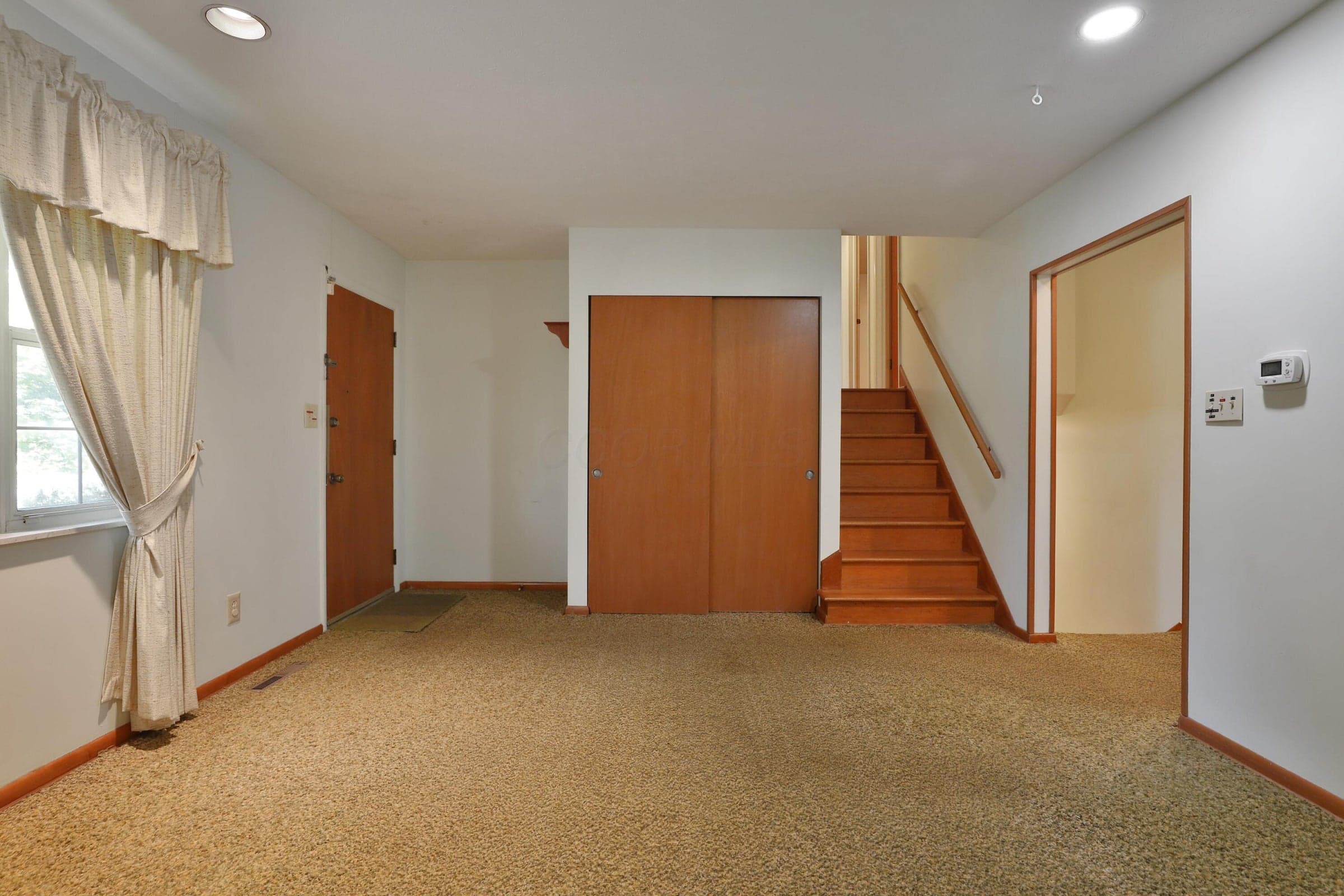 Living Room (Carpet over linoleum)