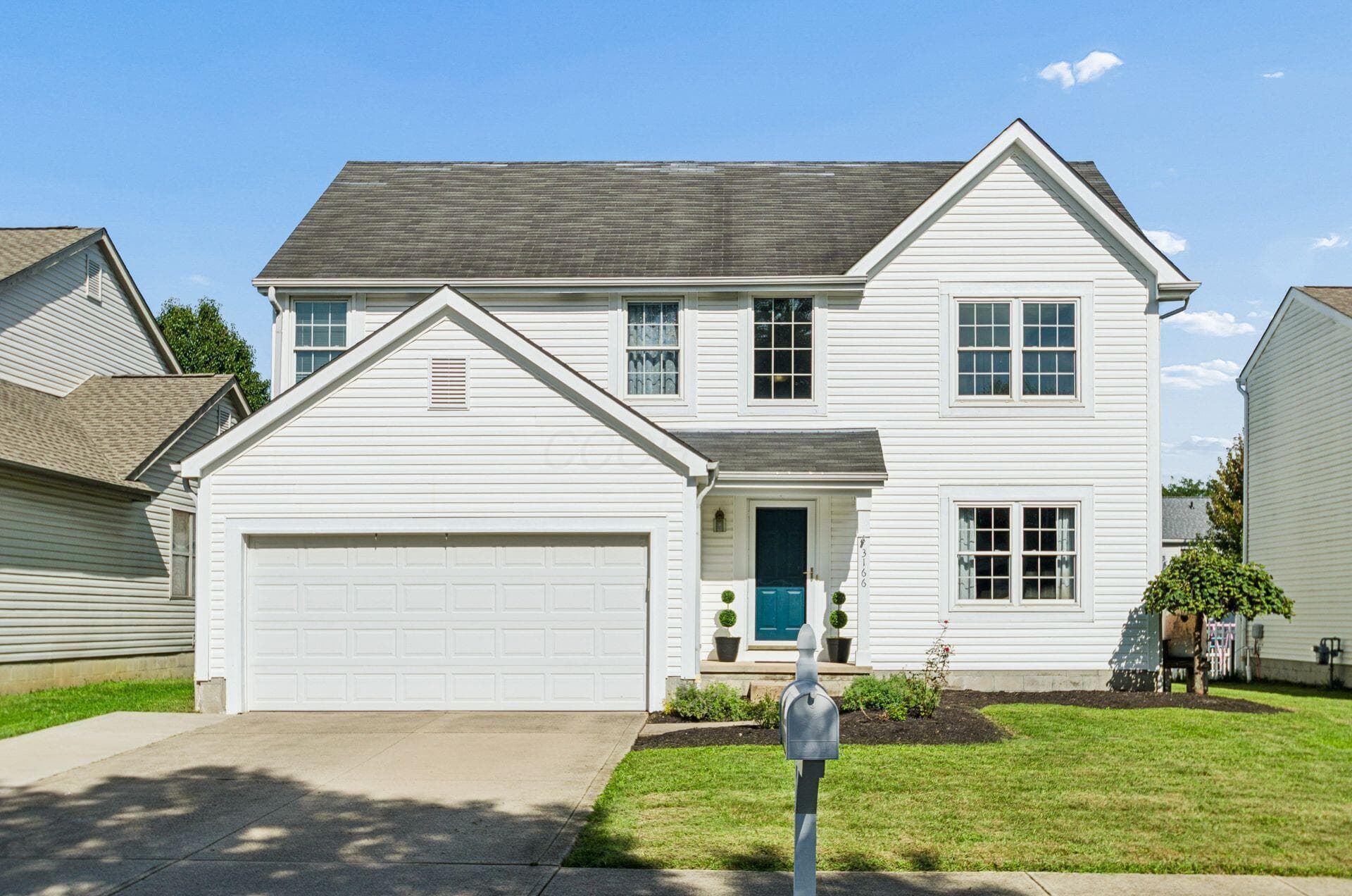 Classic Hilliard Beauty Featuring 3 Season Porch & a Finished Basement.