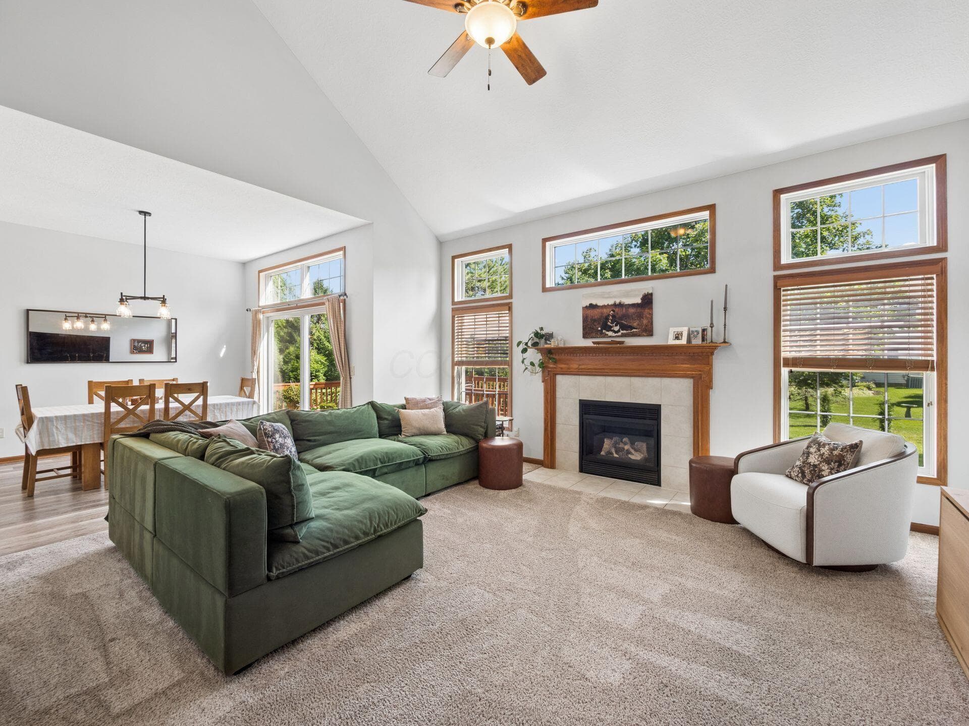 Lots of natural light in the main living spaces with a gas fireplace