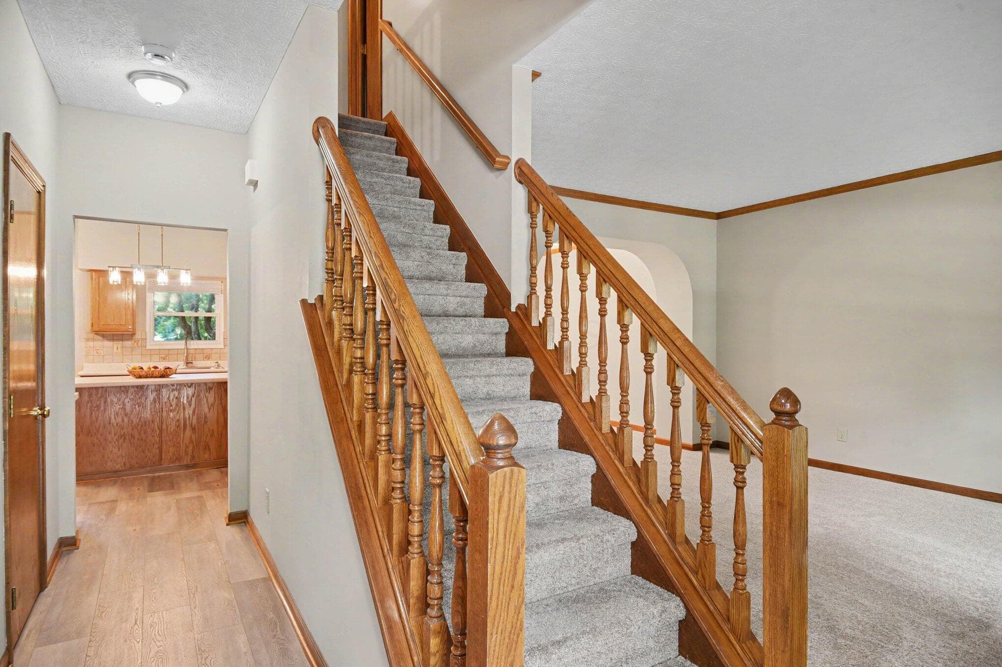 Foyer with new laminate flooring with acess to the kitchen and Living Room areas.