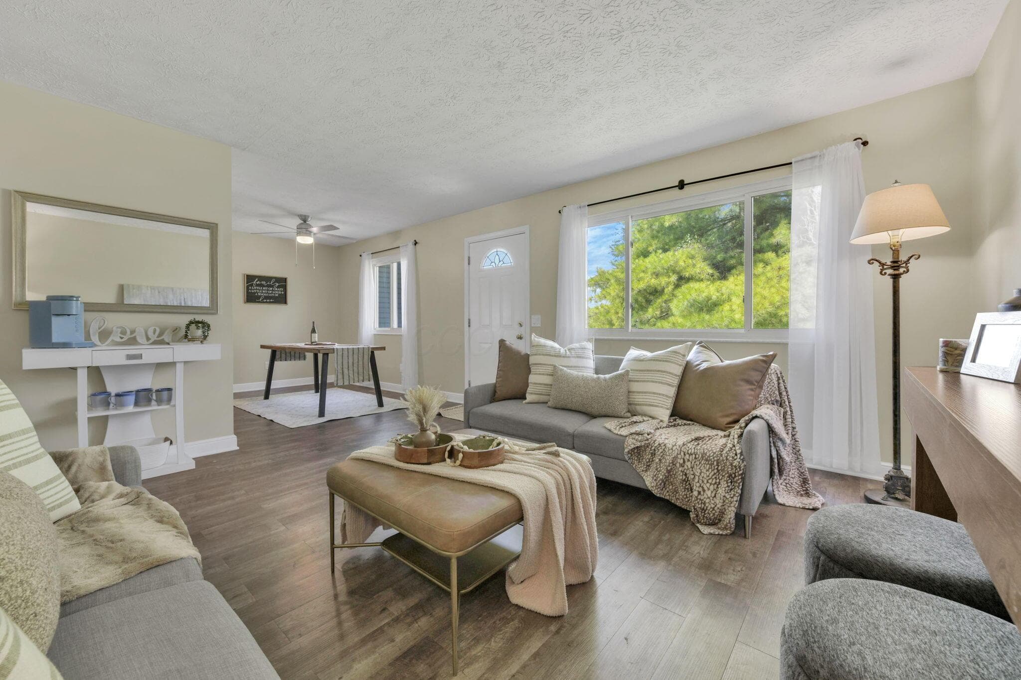 Living Room with New LVP Flooring, Fresh Paint, and Natural Light