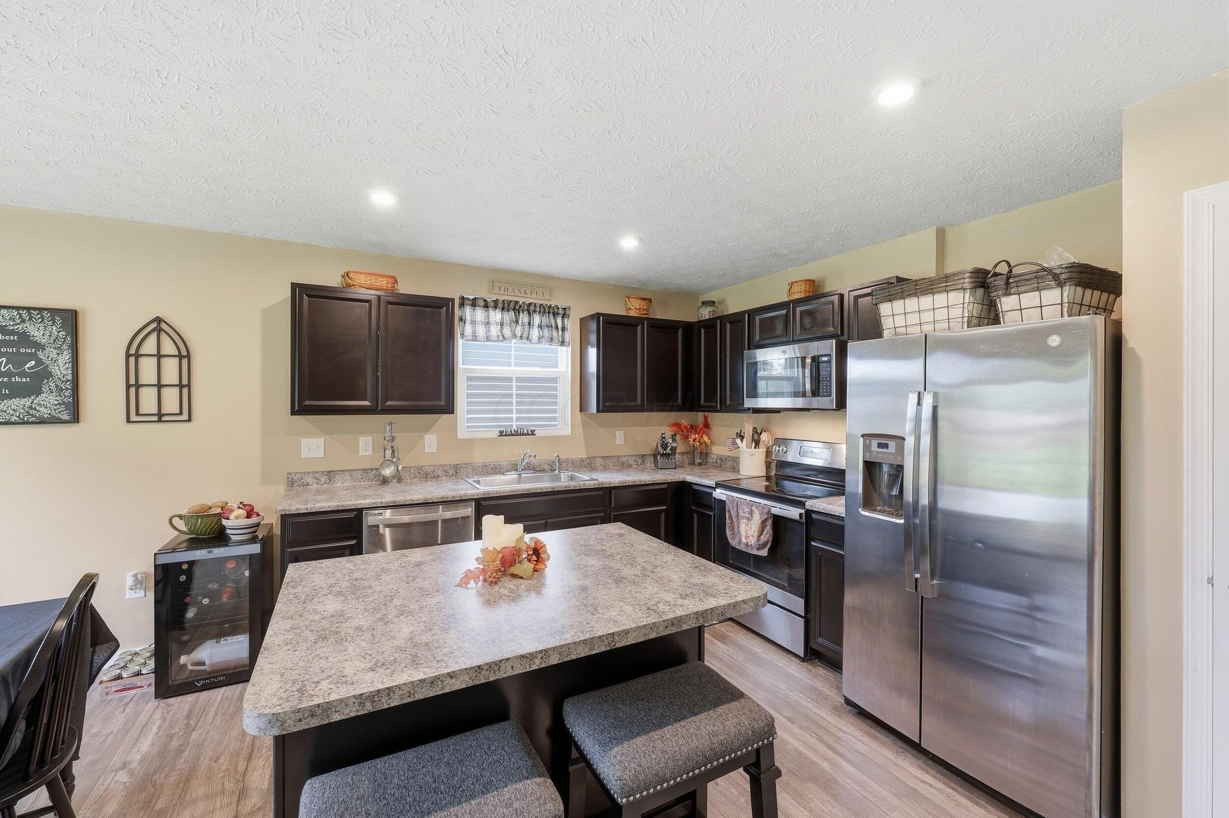 Kitchen features a large island and nice appliances