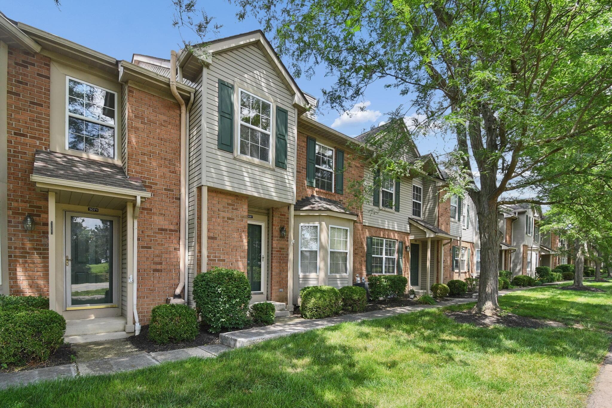 Brick and siding exterior with multiple windows