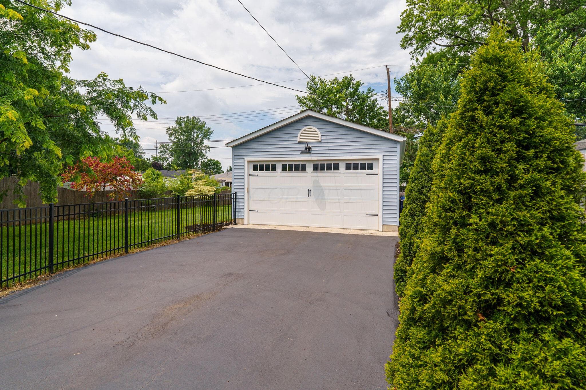 Oversized 4-Car Tandem Garage with 720 Sq Ft of Heated, Insulated Space. Built in 2016, this exceptional 4-car tandem garage offers 220-volt electrical service with the capacity to accommodate an EV charger, an 8' bay door, and 9' ceilings, this versatile space is ideal for large vehicles, storage, hobbies, projects, or creating the ultimate “cave.