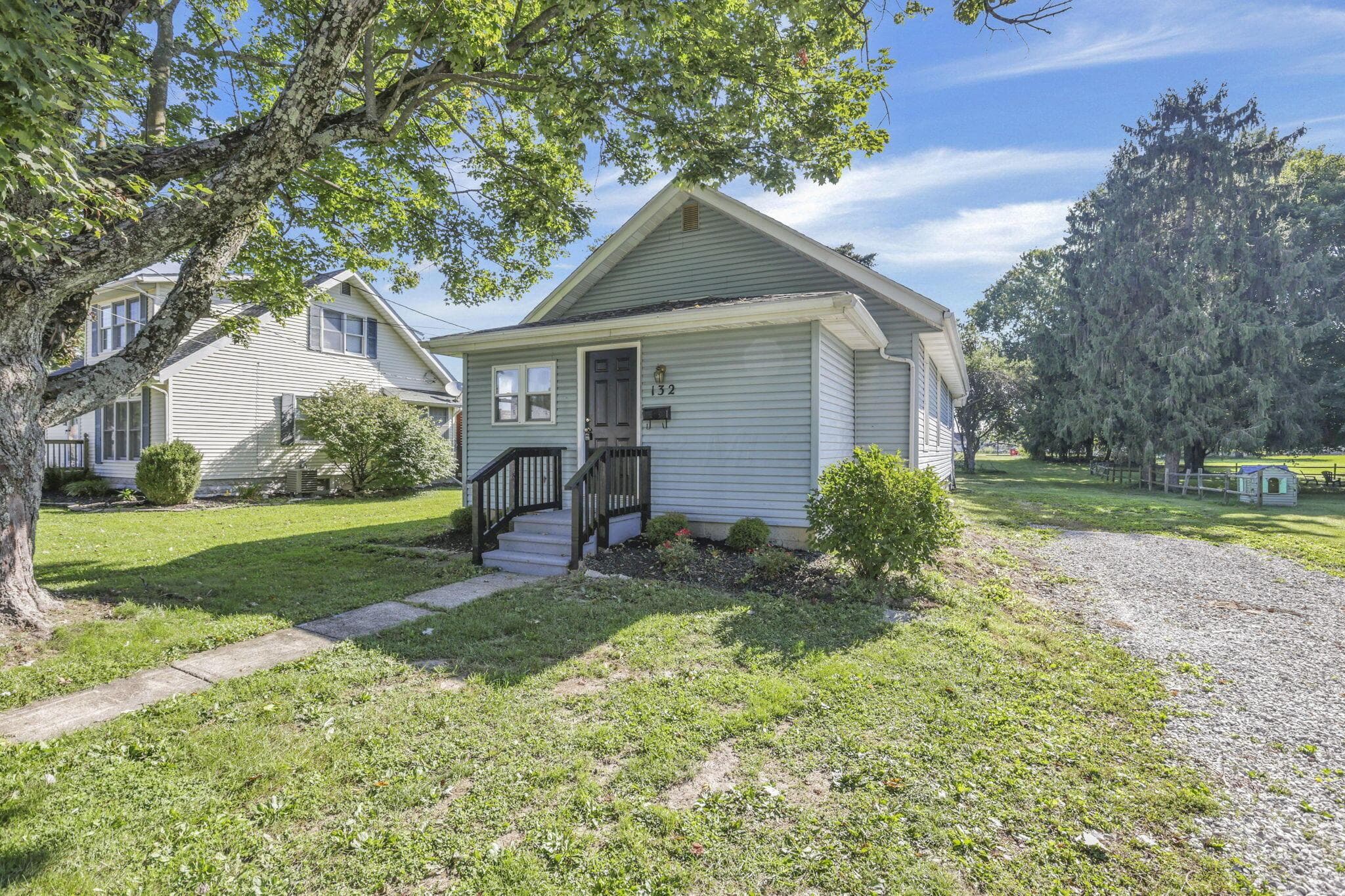 Light blue siding exterior with dark trim accents