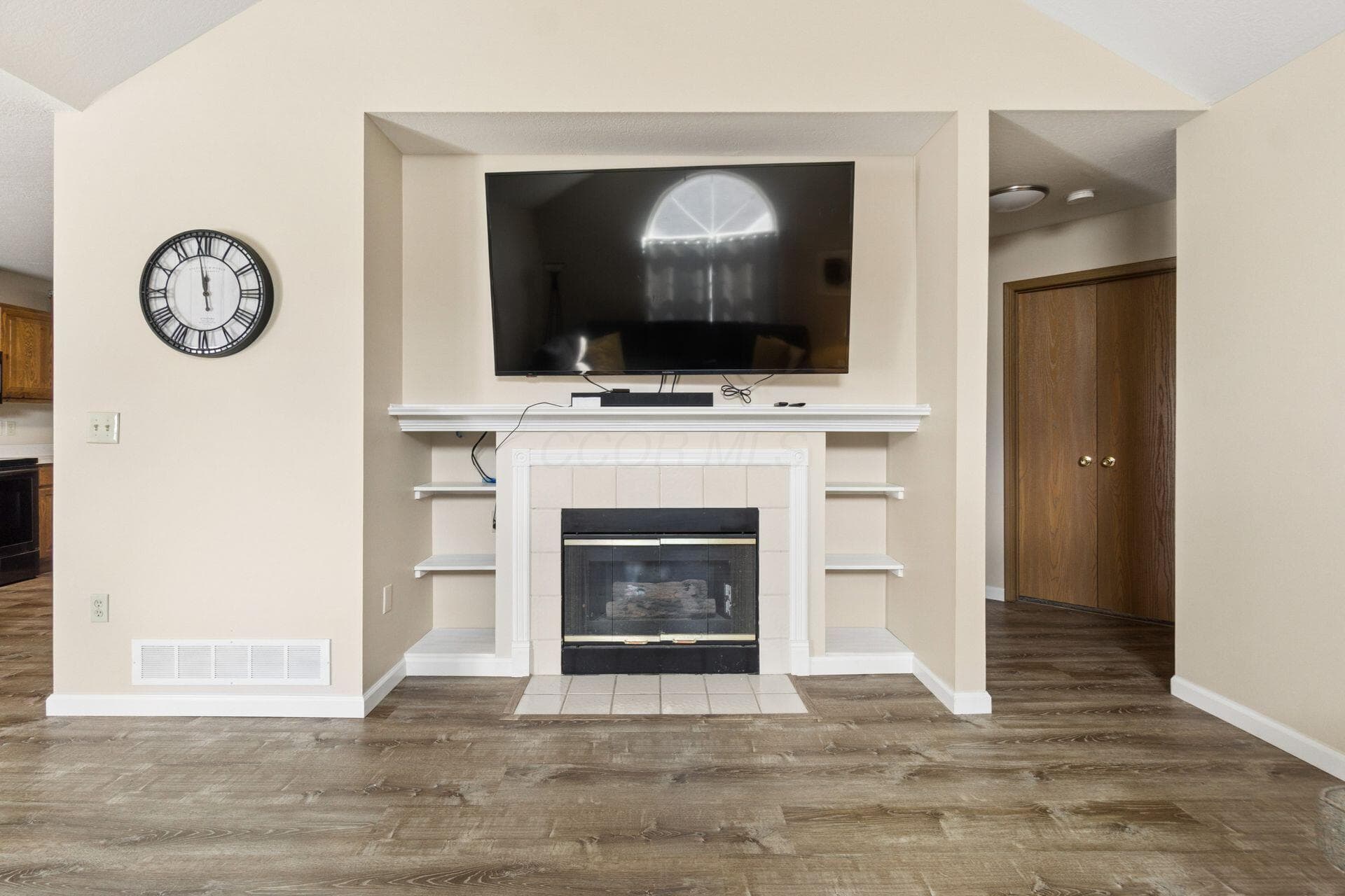 Living Room with Fireplace & Built In Book Shelves