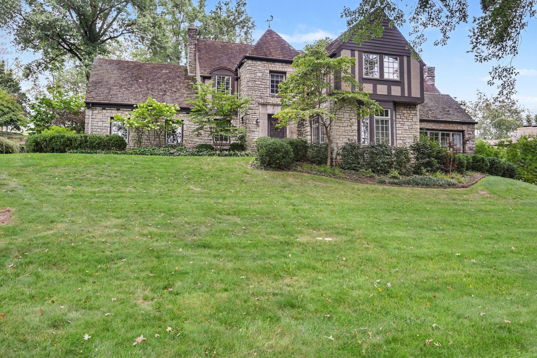 Welcome Home to this 1938 classic stone Tudor offering 3,329 sq. ft., 4 bed/3 baths set on a private 1.24 acre lot directly bordering Rising Park.