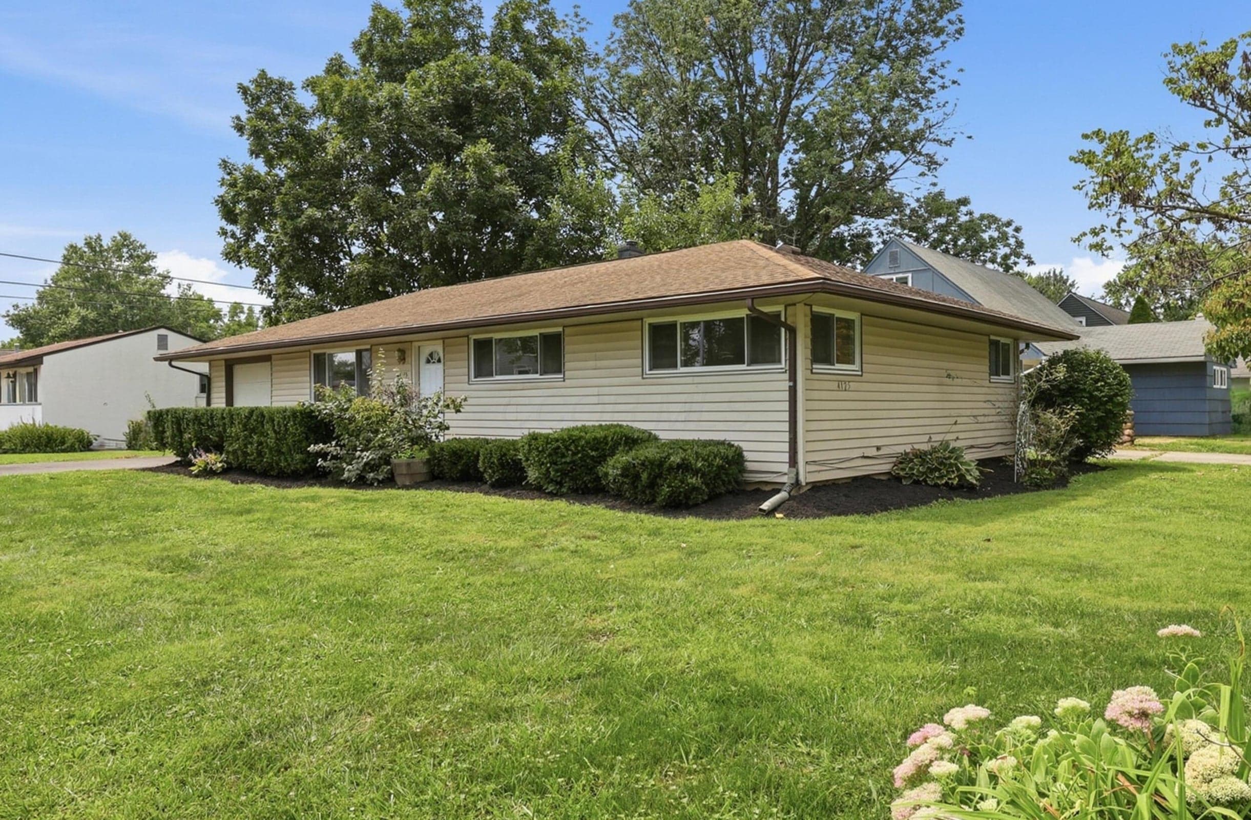 Featured on this stunning corner lot everyone can admire this home.
