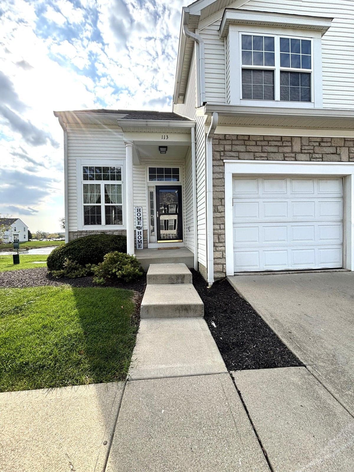End Unit by Pond and Grassy Area